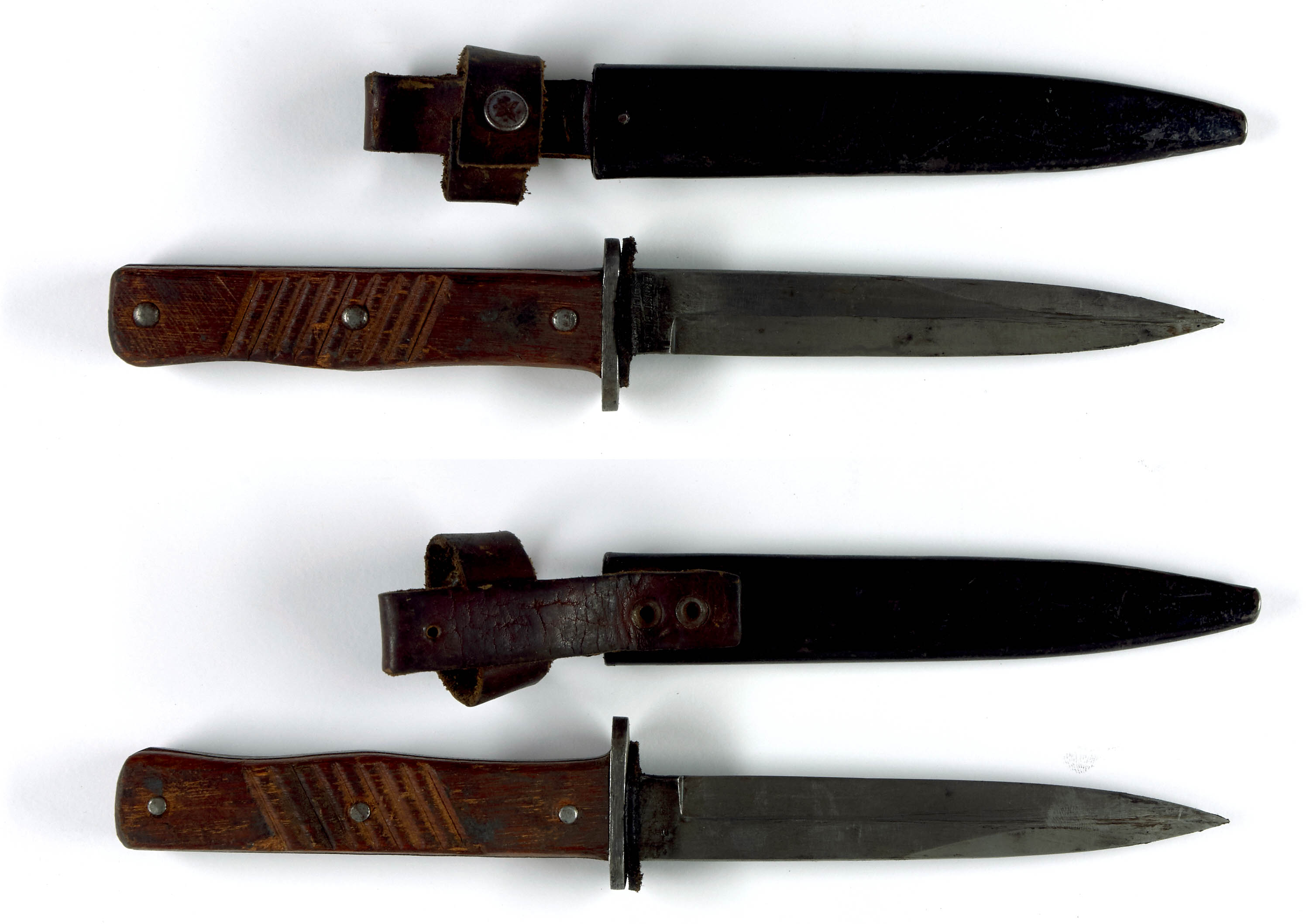 A dagger M 37 for Hitler Youth leaders, with hanger. Maker M7/36, E & F  Hörster, Solingen. Plated blade, the obverse side etched with the motto  Blut und Ehre! (Blood and Honour!).