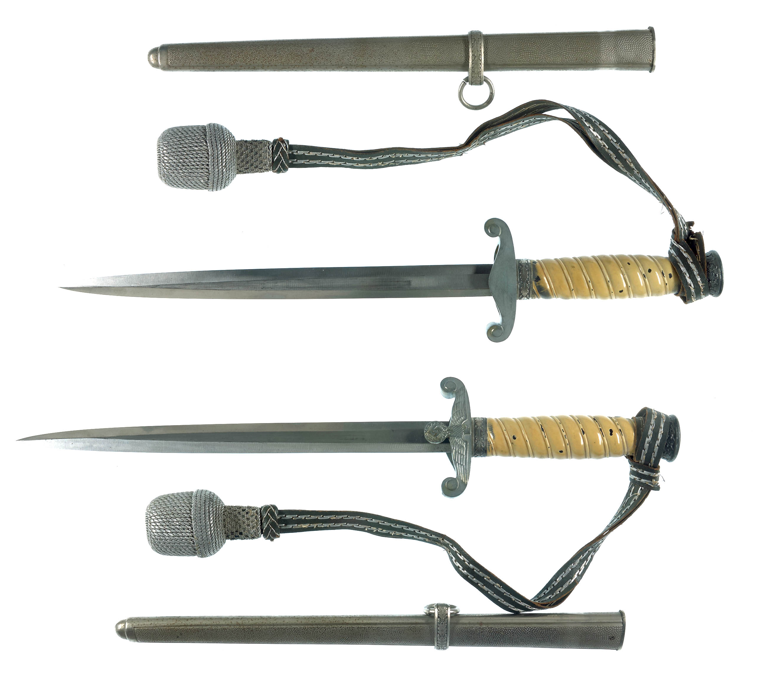 A dagger M 37 for Hitler Youth leaders, with hanger. Maker M7/36, E & F  Hörster, Solingen. Plated blade, the obverse side etched with the motto  Blut und Ehre! (Blood and Honour!).